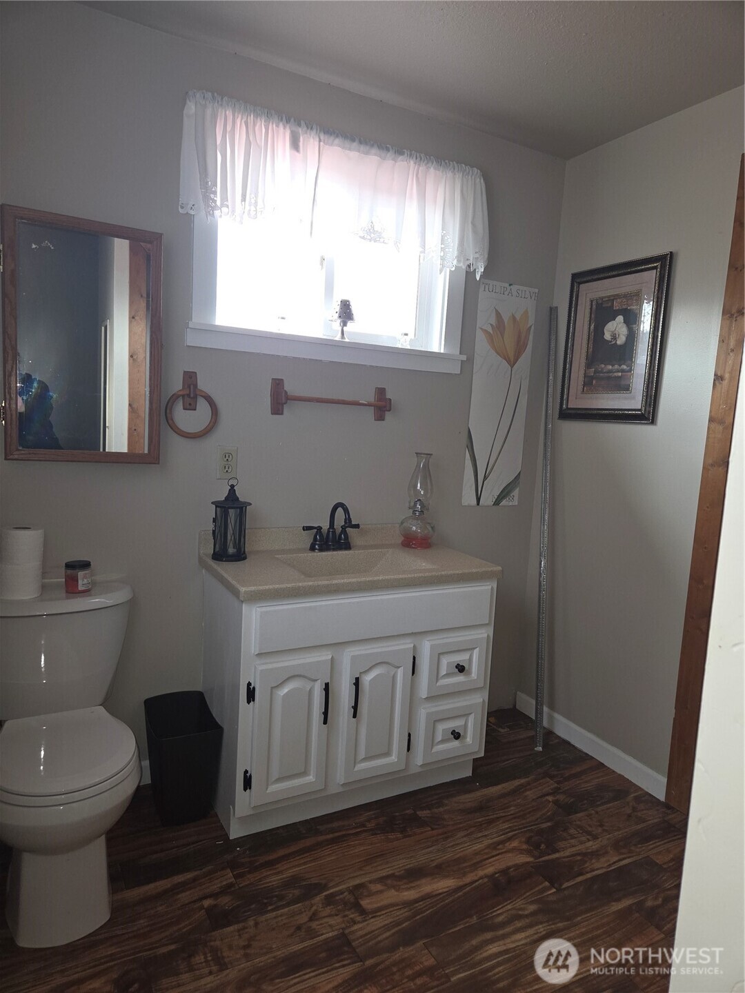 83 East Cayuse Mountain Road Tonasket, WA 98855 - Photo 19 of 37 a bathroom with a toilet a sink and mirror