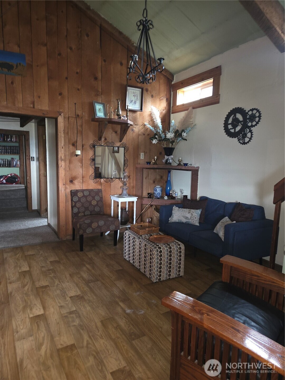 83 East Cayuse Mountain Road Tonasket, WA 98855 - Photo 2 of 37 a living room with furniture and a chandelier
