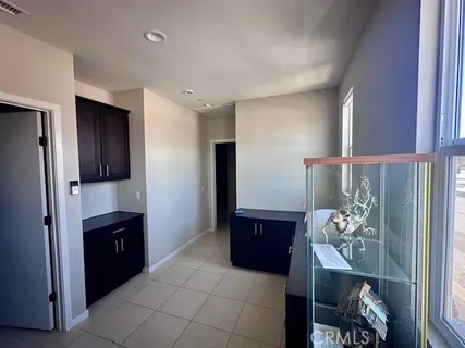 a bathroom with a walk in closet and mirror