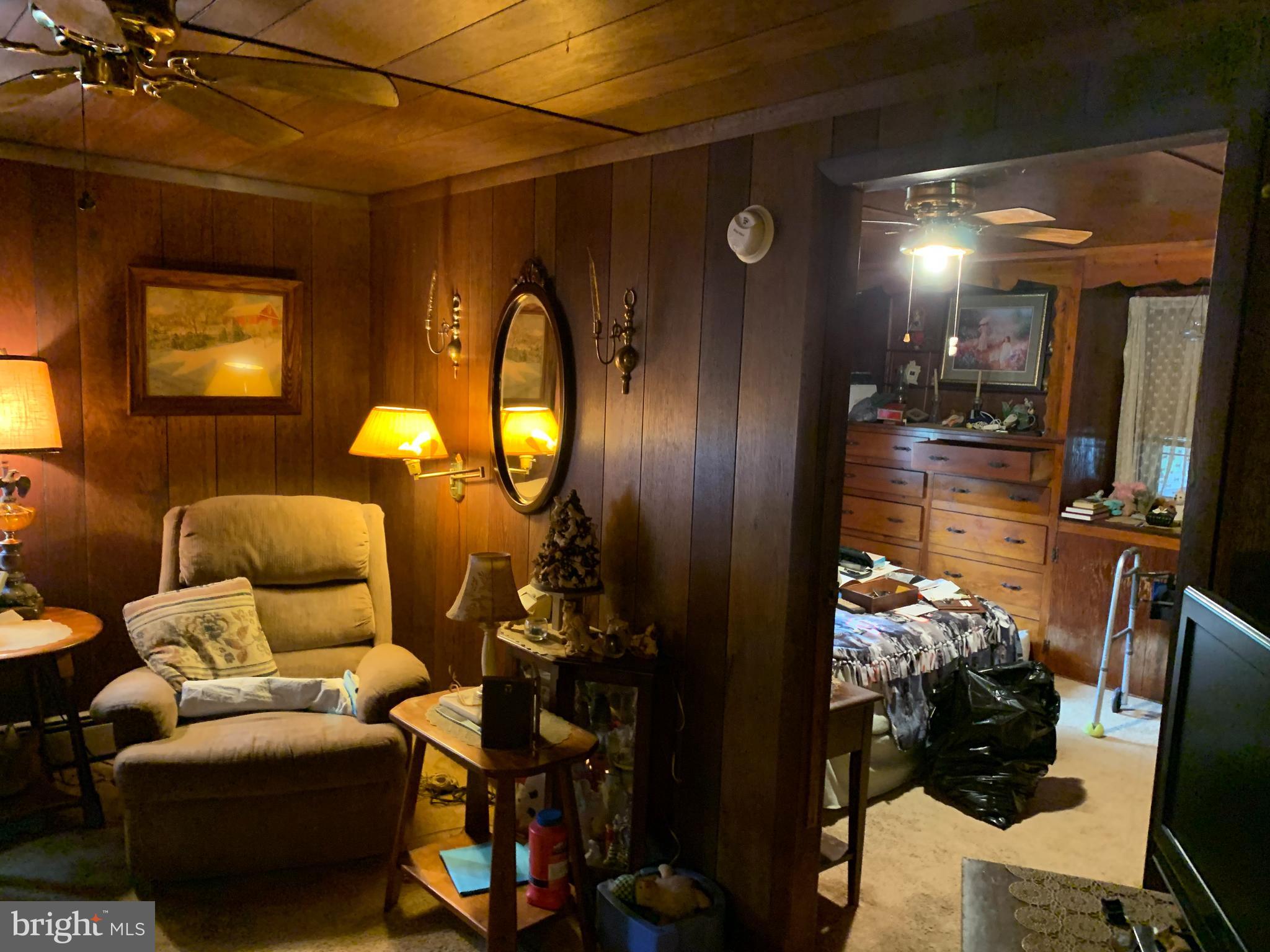 303 Meadowbrook Road Robbinsville, NJ 08691 - Photo 16 of 24 a living room with furniture and a chandelier