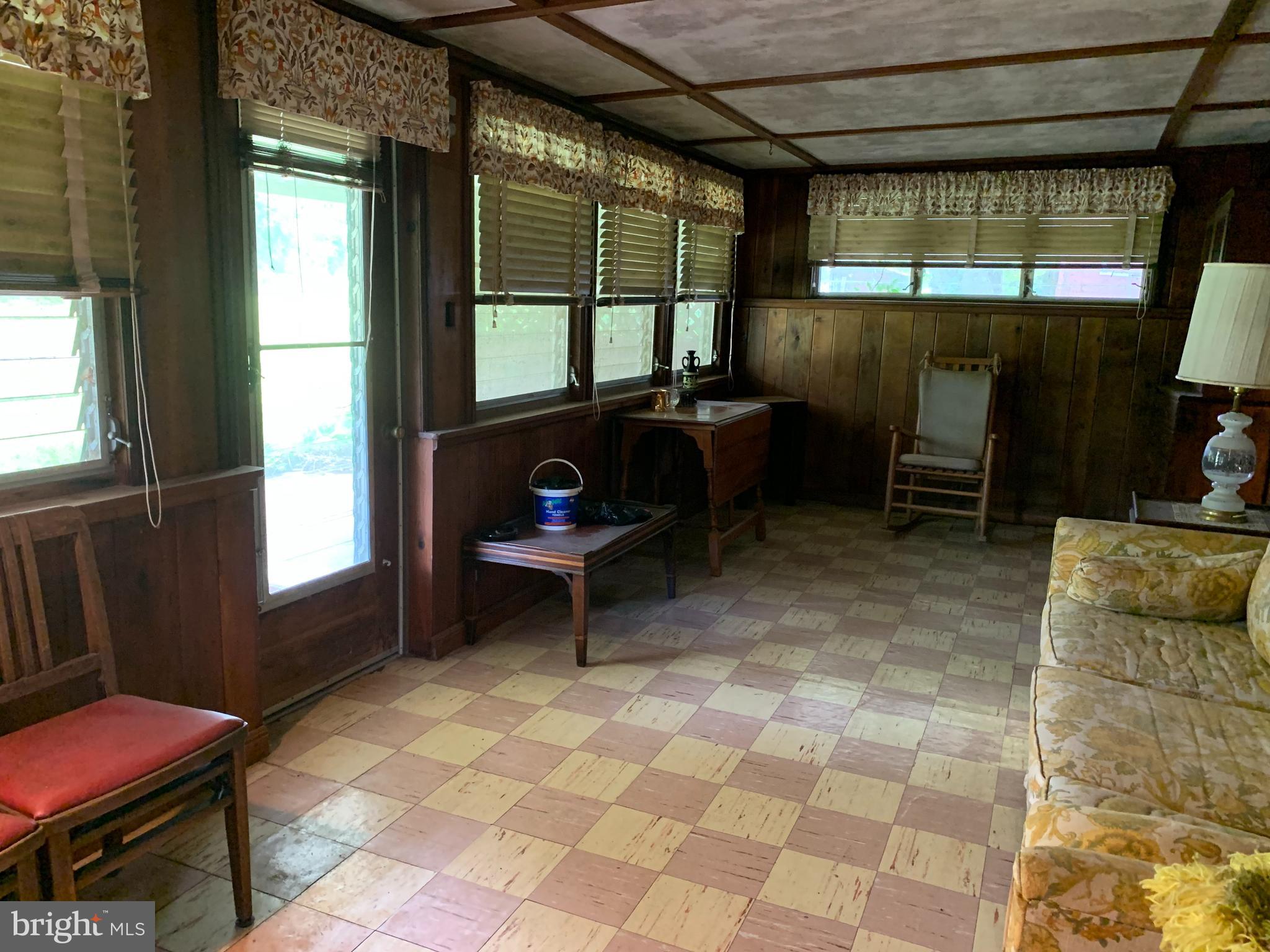 303 Meadowbrook Road Robbinsville, NJ 08691 - Photo 21 of 24 a living room with furniture a window and a flat screen tv