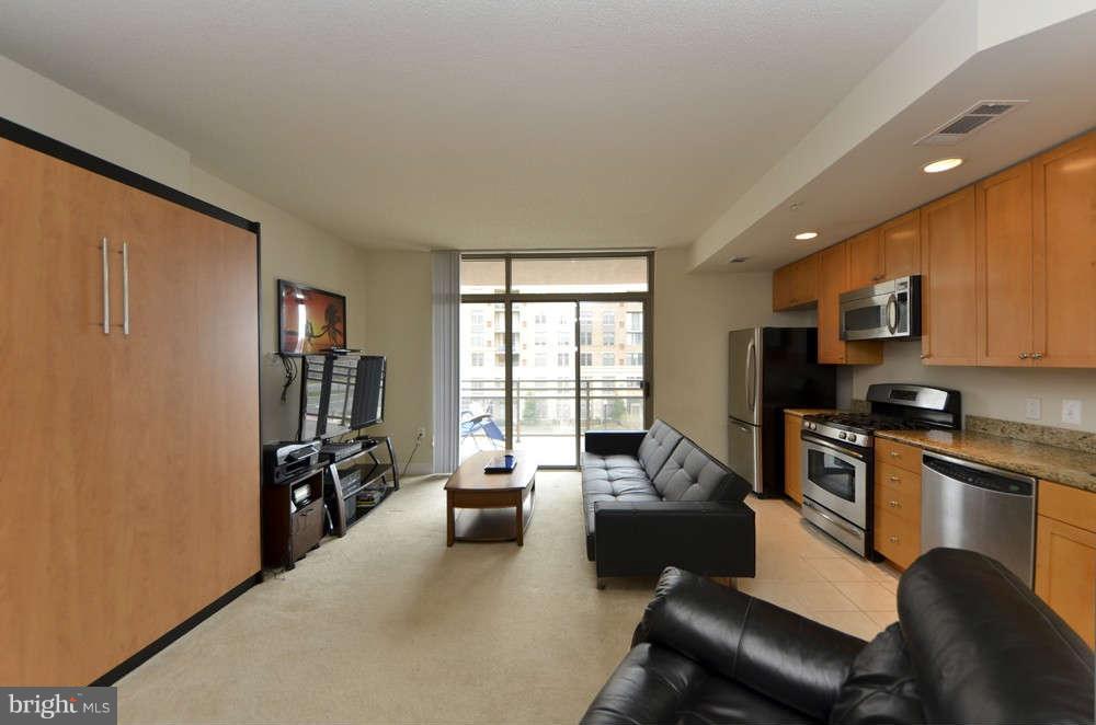 3650 South Glebe Road, Unit 349 Arlington, VA 22202 - Photo 3 of 21 a living room with furniture and a flat screen tv