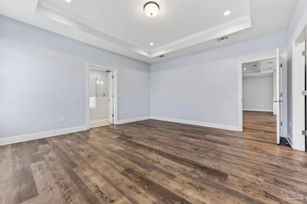 a kitchen with sink cabinets and a wooden floor