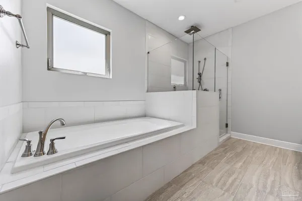 a front view of a house with swimming pool having outdoor seating