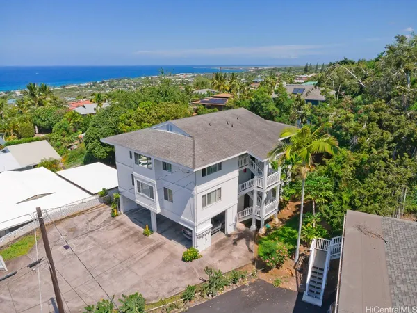 an aerial view of a house with a garden