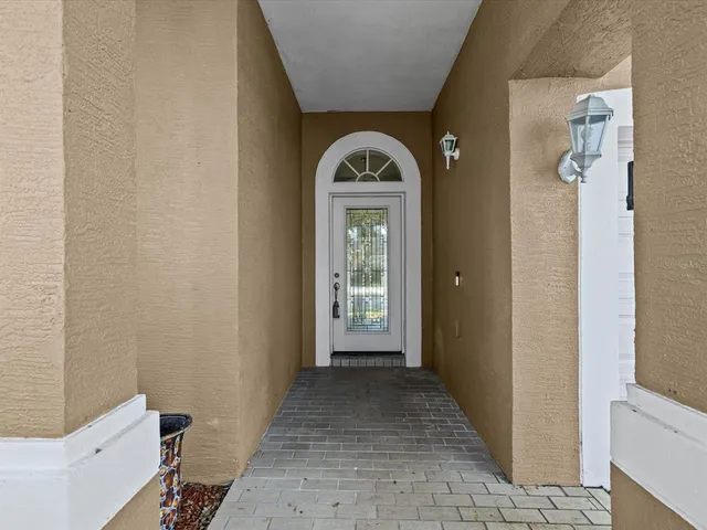 a view of a hallway with windows