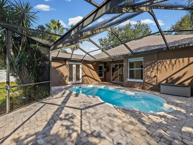 a view of a backyard with a patio