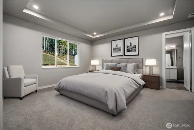 a bedroom with a large bed and a couch