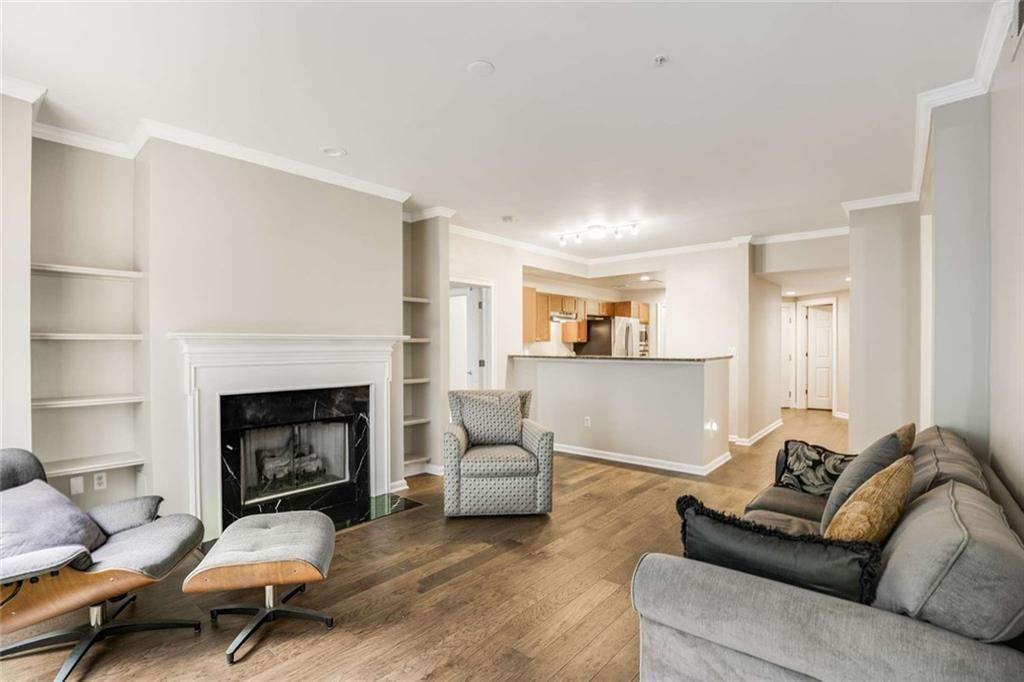 3275 Lenox Road Northeast, Unit 302 Atlanta, GA 30324 - Photo 16 of 50 a living room with furniture and a fireplace