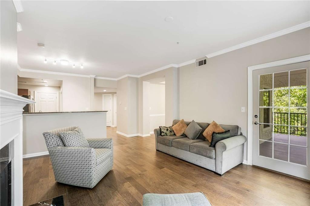 3275 Lenox Road Northeast, Unit 302 Atlanta, GA 30324 - Photo 17 of 50 a living room with furniture and a potted plant