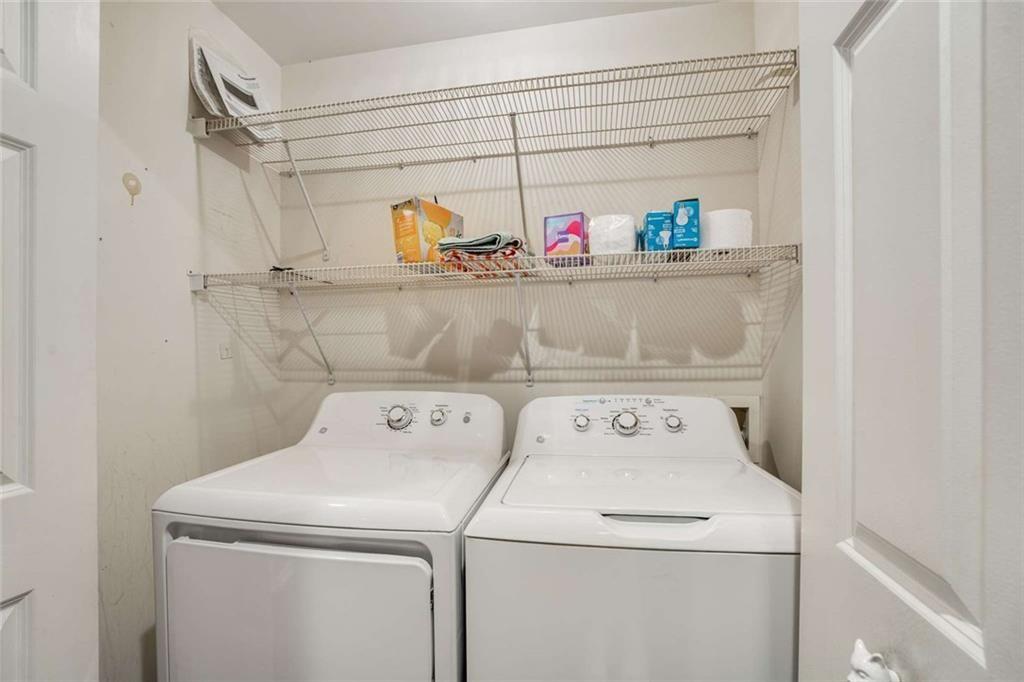 3275 Lenox Road Northeast, Unit 302 Atlanta, GA 30324 - Photo 18 of 50 a utility room with dryer and washer