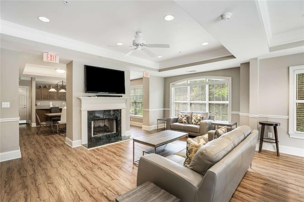 3275 Lenox Road Northeast, Unit 302 Atlanta, GA 30324 - Photo 38 of 50 a living room with fireplace furniture and a flat screen tv
