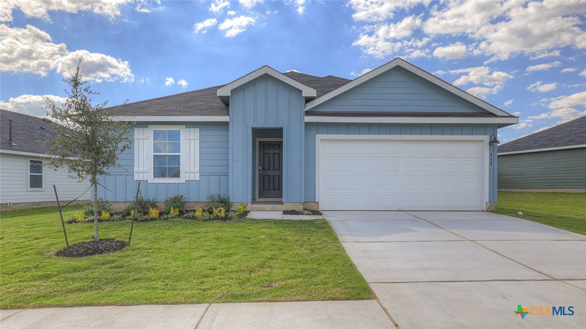 418 Hodges Street Maxwell, TX 78656 - Photo 1 of 32 a front view of a house with a yard