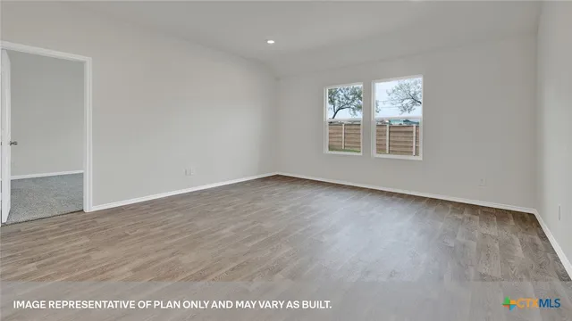 a kitchen with stainless steel appliances granite countertop a stove top oven a sink and a refrigerator