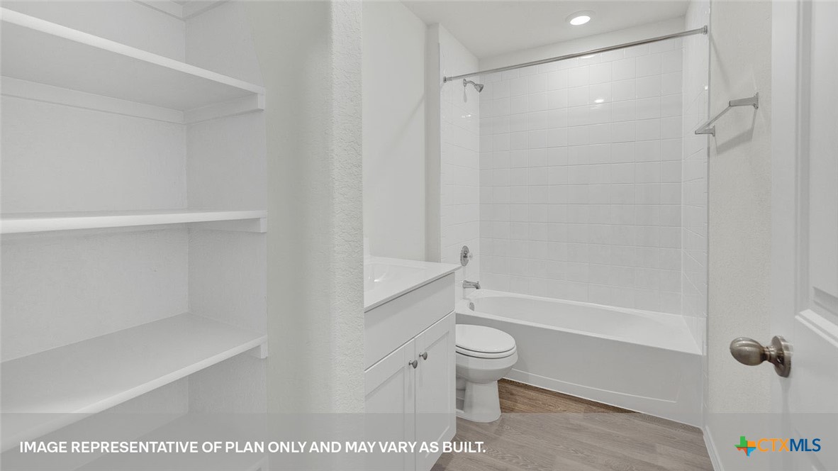 418 Hodges Street Maxwell, TX 78656 - Photo 6 of 32 a bathroom with a toilet and a shower