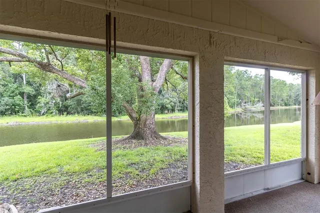 a view of a house with backyard porch and garden