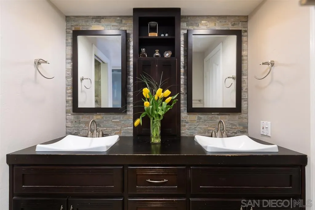 323 Shoemaker Lane Solana Beach, CA 92075 - Photo 12 of 25 a bathroom with a sink and a mirror