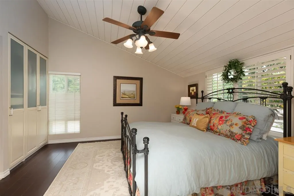 323 Shoemaker Lane Solana Beach, CA 92075 - Photo 16 of 25 a bed room with furniture and a chandelier