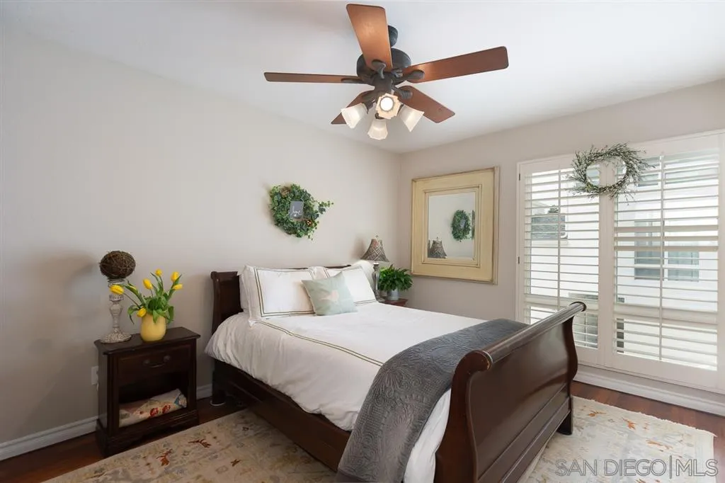323 Shoemaker Lane Solana Beach, CA 92075 - Photo 17 of 25 a bedroom with a bed table and a window