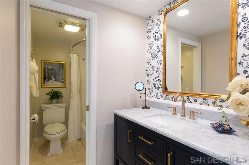 323 Shoemaker Lane Solana Beach, CA 92075 - Photo 18 of 25 a bathroom with a granite countertop sink toilet and shower