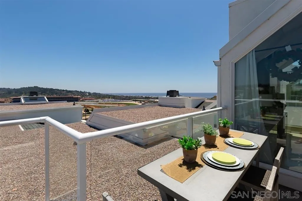 323 Shoemaker Lane Solana Beach, CA 92075 - Photo 22 of 25 a kitchen with a table and chairs in it