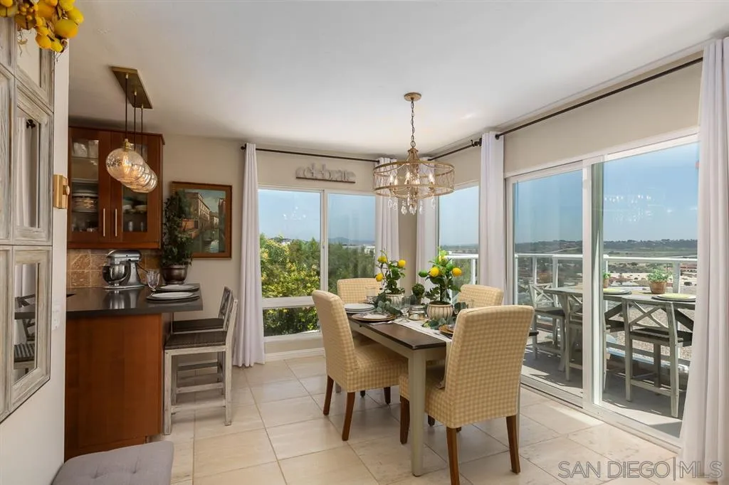 323 Shoemaker Lane Solana Beach, CA 92075 - Photo 4 of 25 a view of a dining room and livingroom with furniture wooden floor a chandelier