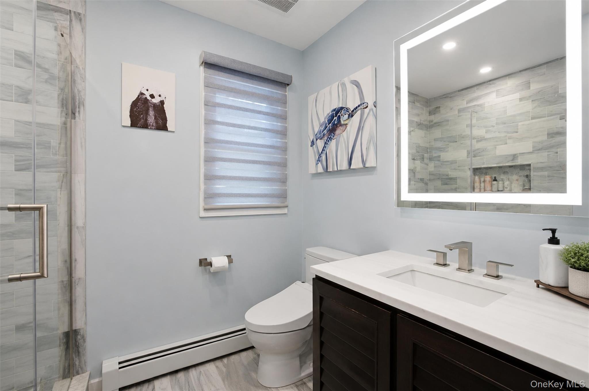 617 Cardinal Road Cortlandt Manor, NY 10567 - Photo 19 of 32 Contemporary bathroom featuring a dark wood-finish vanity with a white countertop and rectangular undermount sink