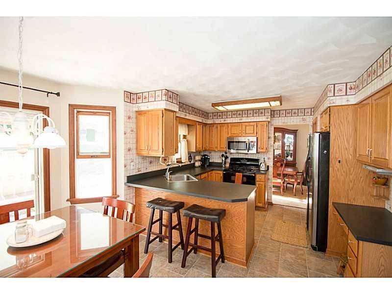 2235 Hyland Road Irwin, PA 15642 - Photo 6 of 23 Kitchen and Breakfast Area leading to back patio
