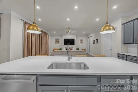 a dining room with furniture window and wooden floor
