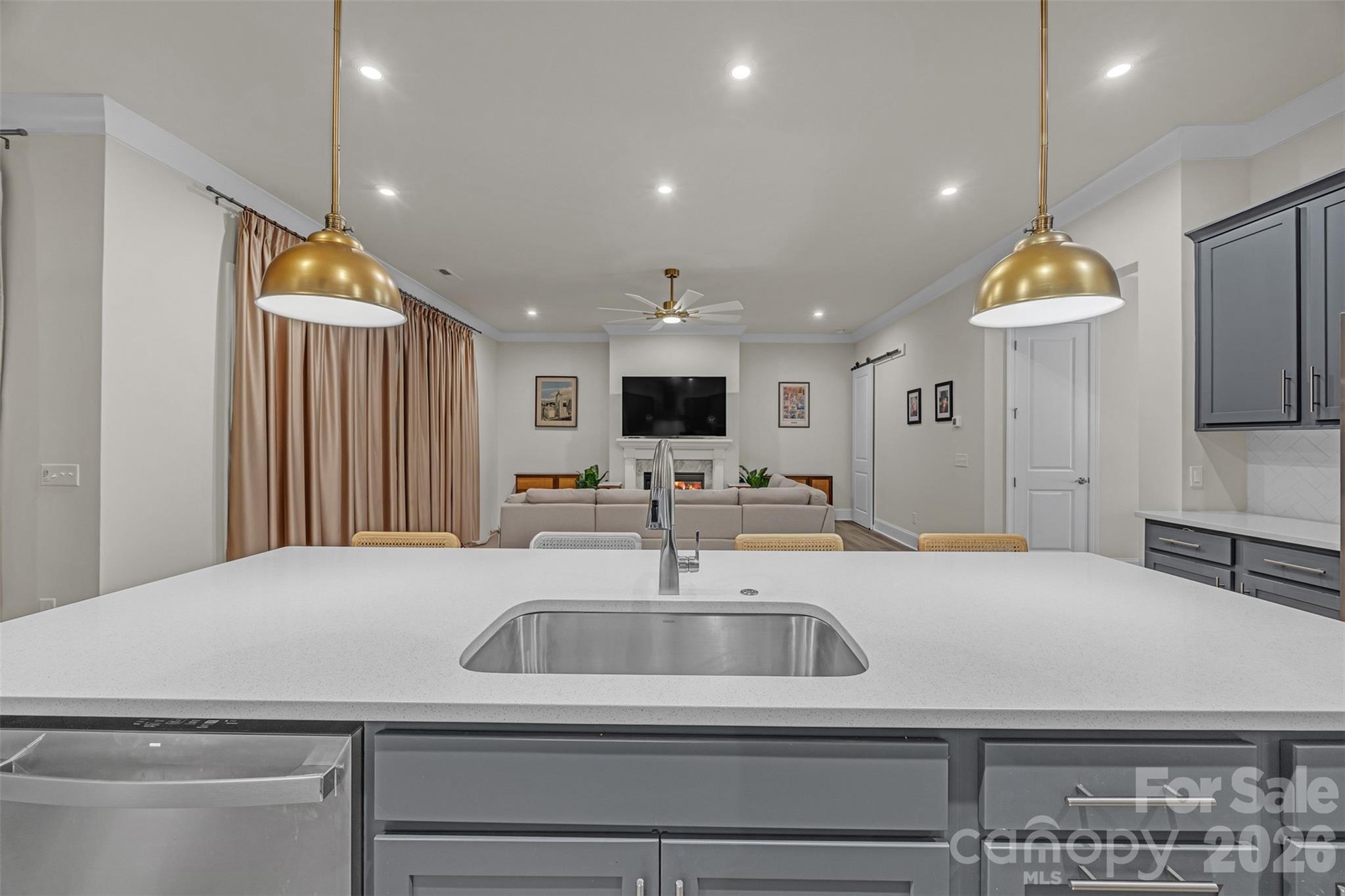 513 Meadow Ridge Drive Belmont, NC 28012 - Photo 11 of 40 a kitchen with a sink and a refrigerator