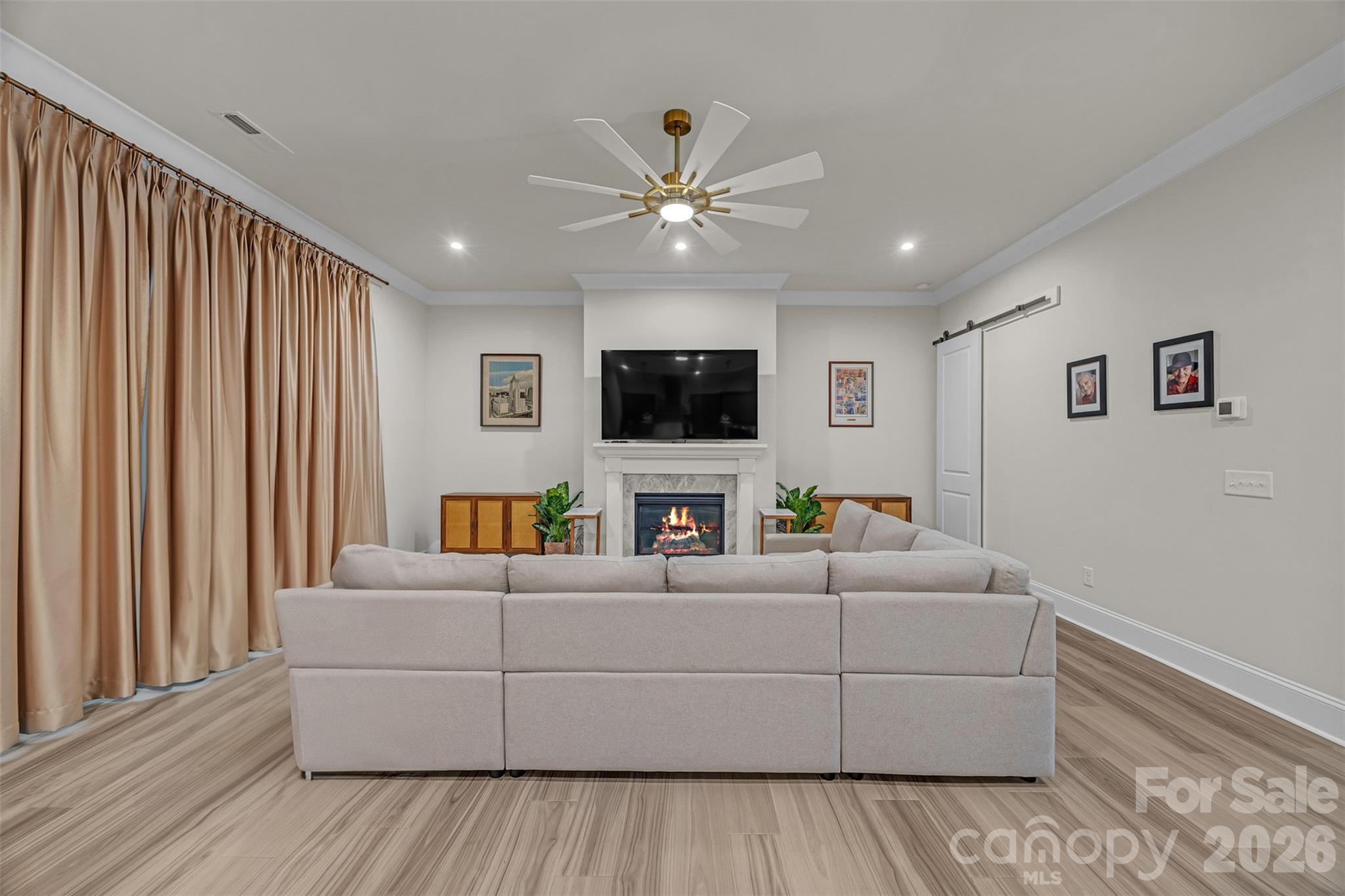 513 Meadow Ridge Drive Belmont, NC 28012 - Photo 14 of 40 a living room with furniture and a flat screen tv