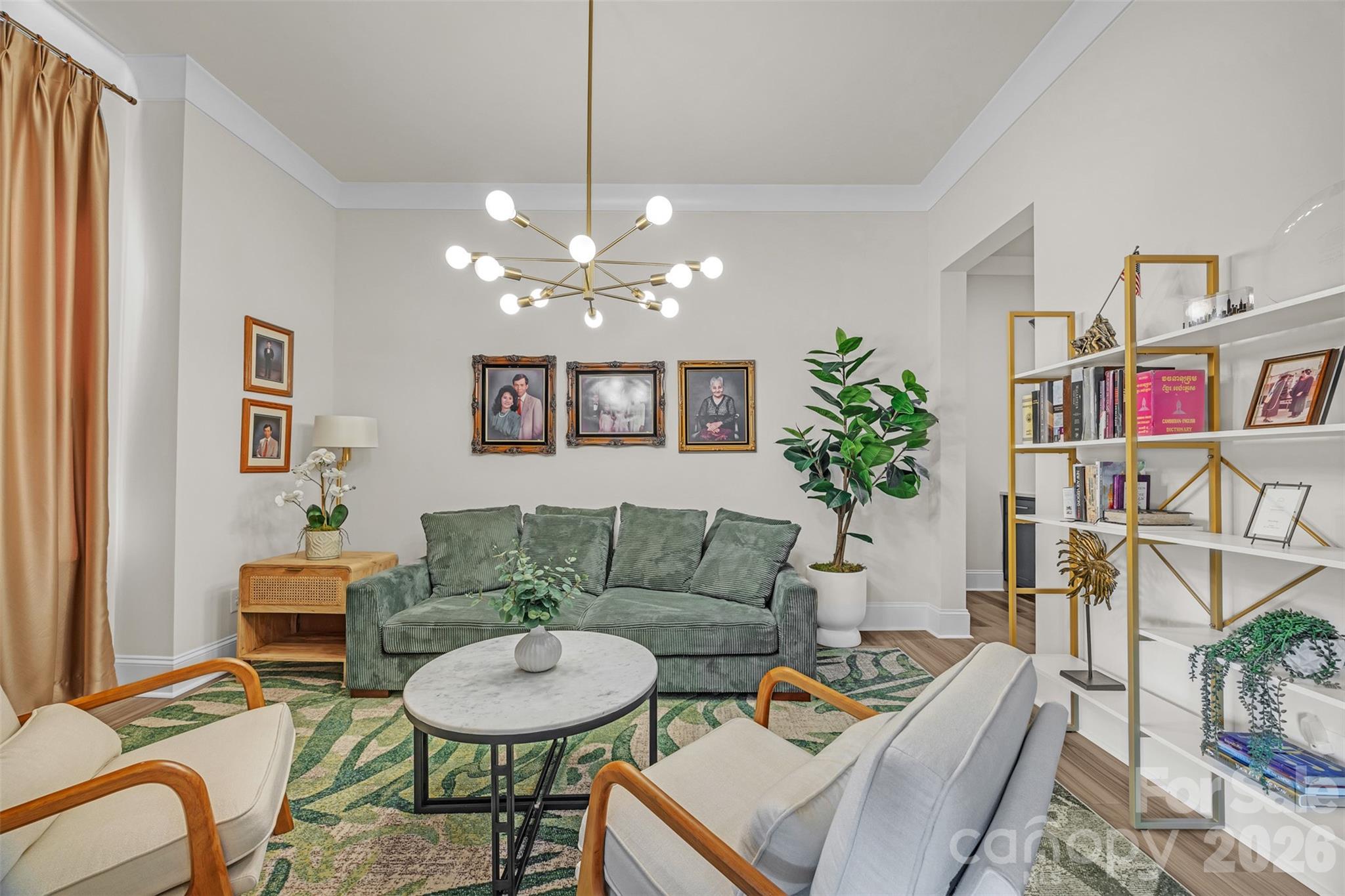 513 Meadow Ridge Drive Belmont, NC 28012 - Photo 17 of 40 a living room with furniture and a chandelier