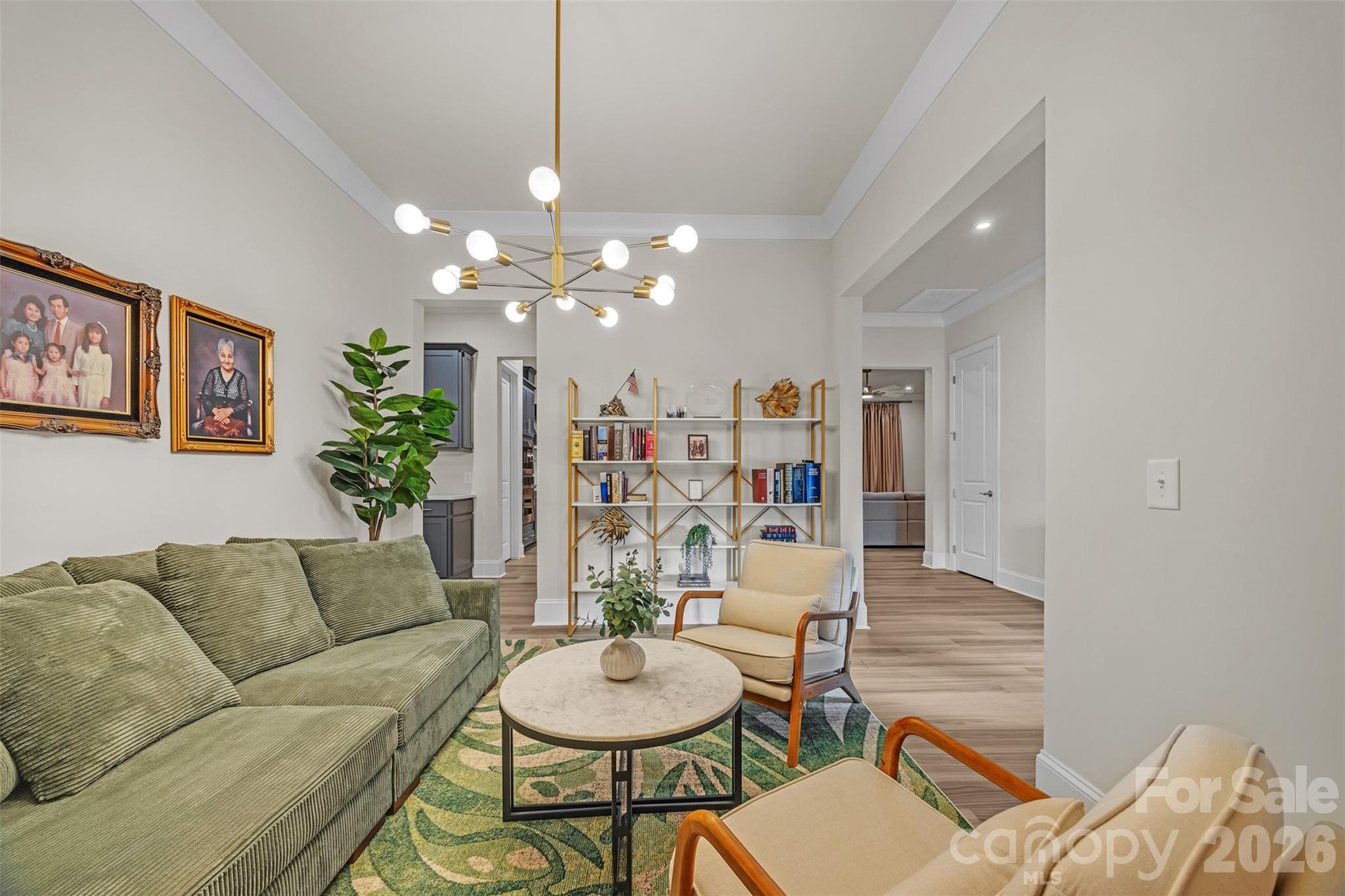 513 Meadow Ridge Drive Belmont, NC 28012 - Photo 19 of 40 a living room with furniture and a chandelier
