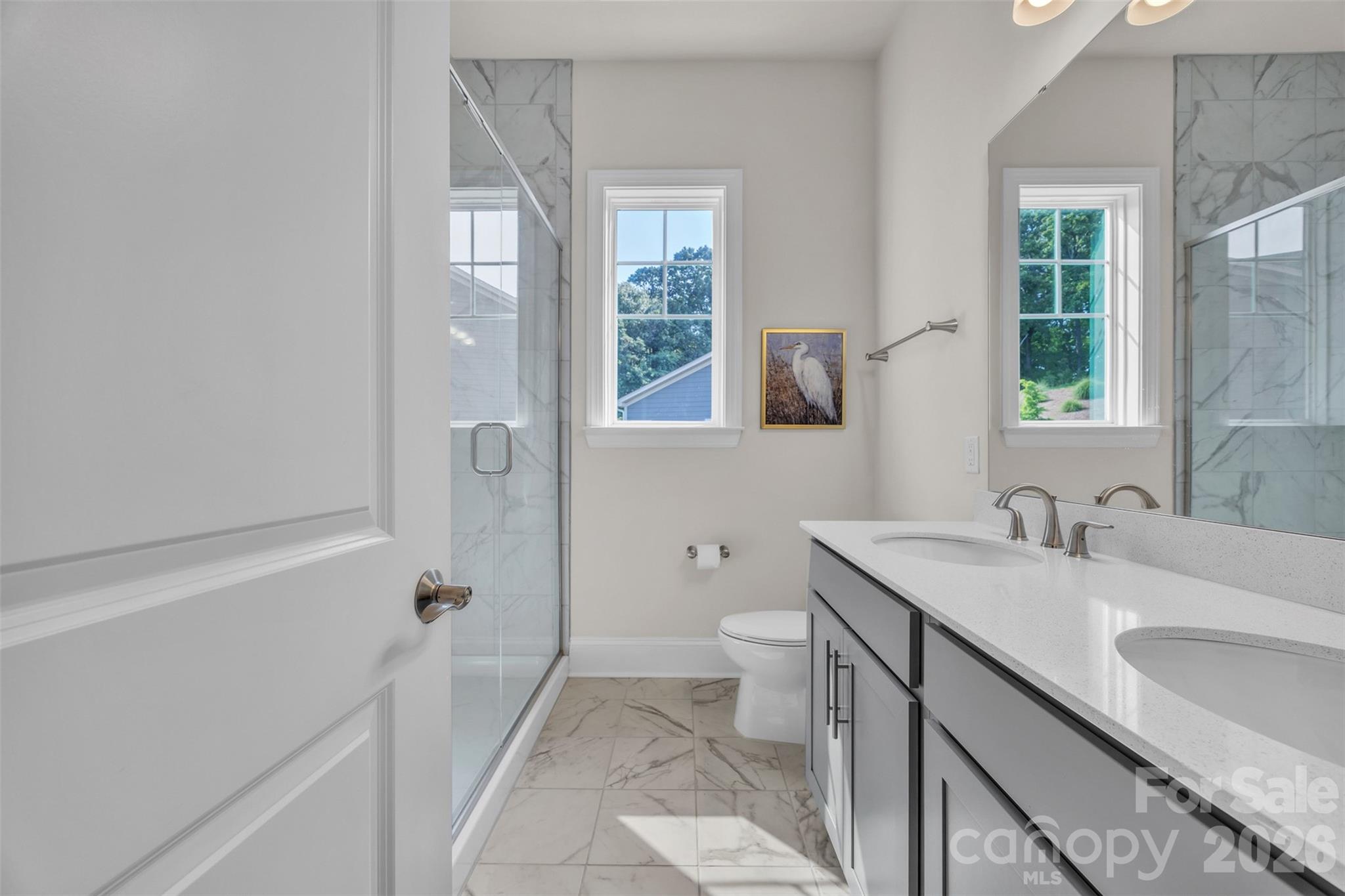 513 Meadow Ridge Drive Belmont, NC 28012 - Photo 21 of 40 a bathroom with a sink a toilet and a bathtub