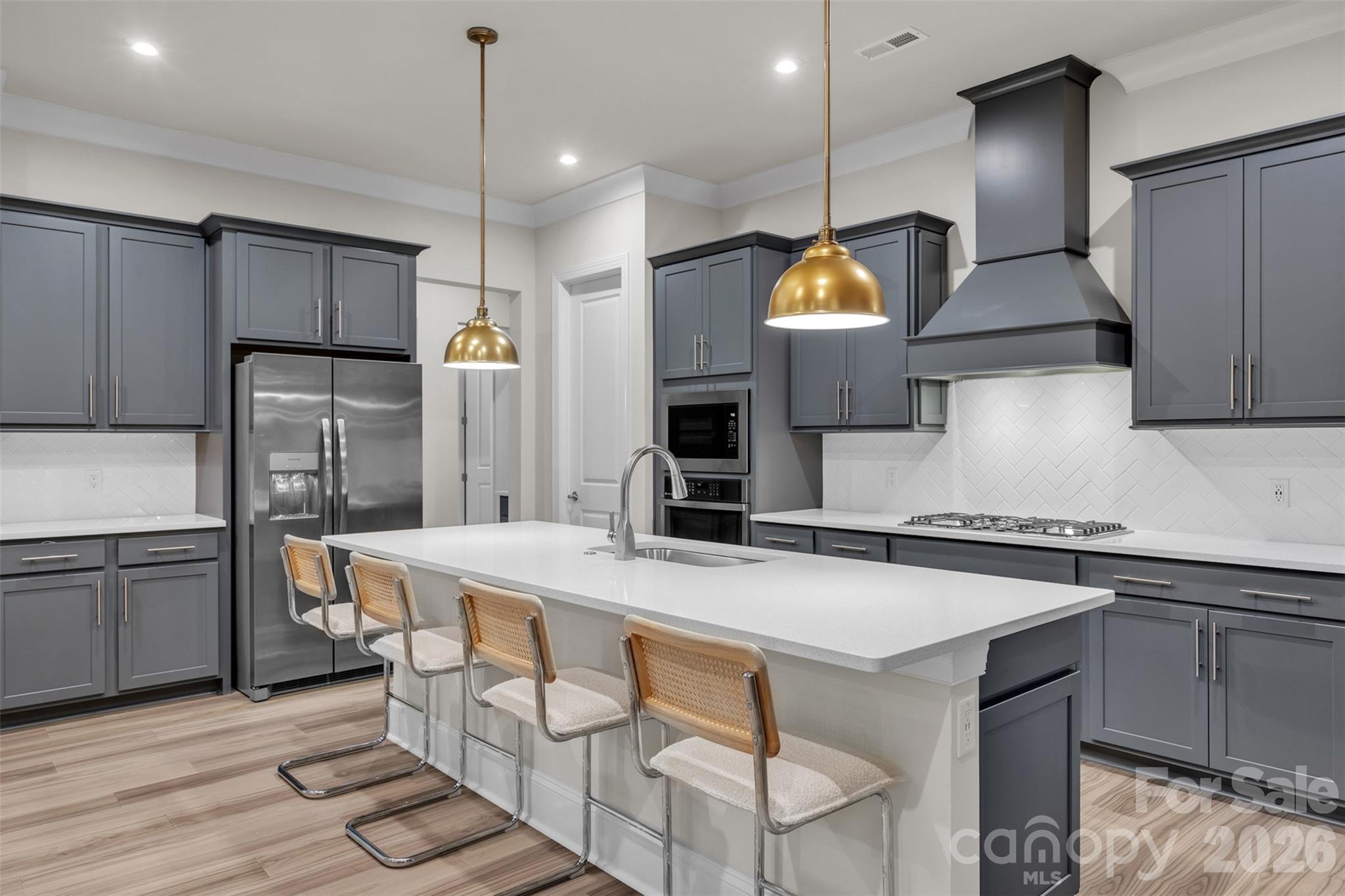 513 Meadow Ridge Drive Belmont, NC 28012 - Photo 3 of 40 a kitchen with stainless steel appliances granite countertop a sink a stove and refrigerator