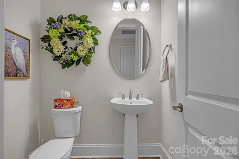 a view of a room with wooden floor and cabinet