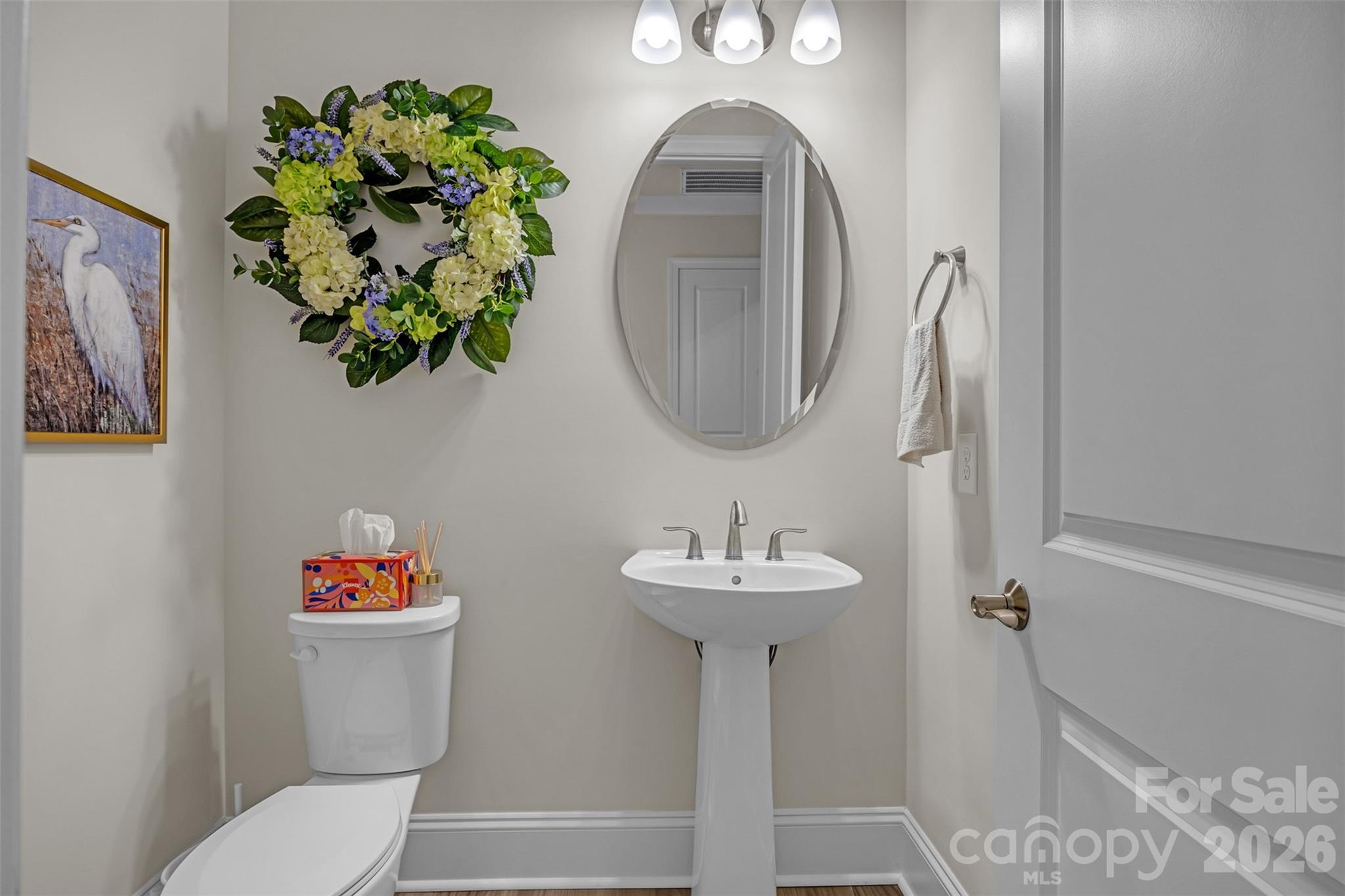 513 Meadow Ridge Drive Belmont, NC 28012 - Photo 31 of 40 a bathroom with a toilet sink and mirror