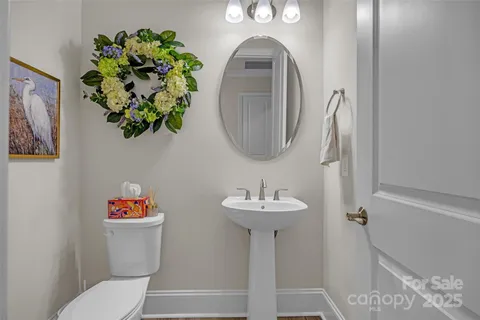 a view of a room with wooden floor and cabinet