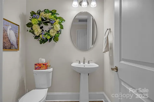 a view of a room with wooden floor and cabinet