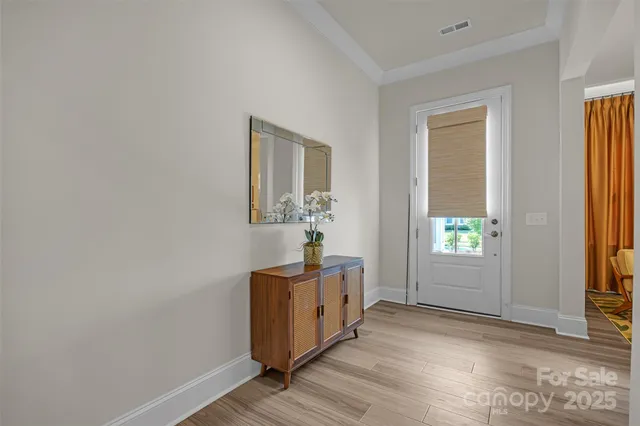 a bedroom with a bed lamp and a window