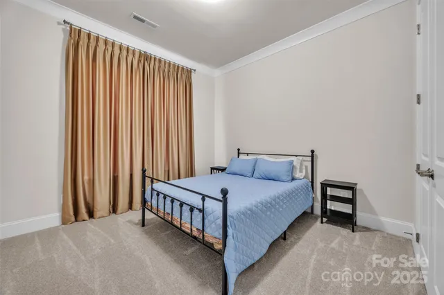 a a bedroom with a bed and a window