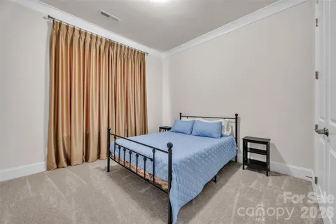 a kitchen with stainless steel appliances granite countertop a kitchen island a stove and a sink