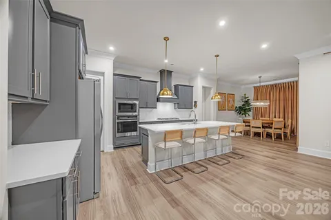 a kitchen with a sink and a refrigerator