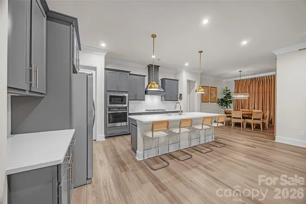 a kitchen with a sink and a refrigerator