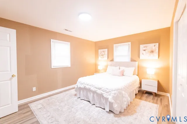 a bedroom with a bed and a table