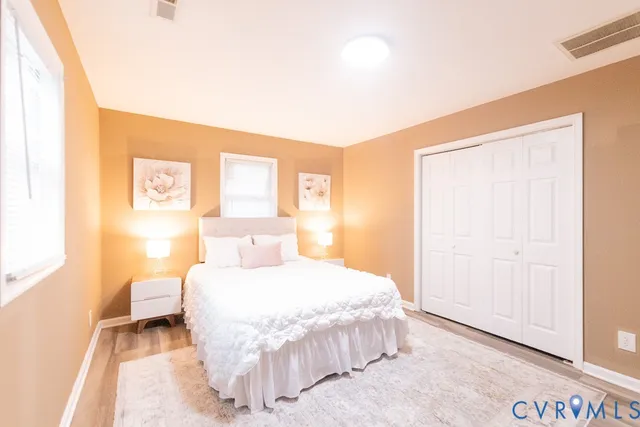 a bedroom with a bed and a table