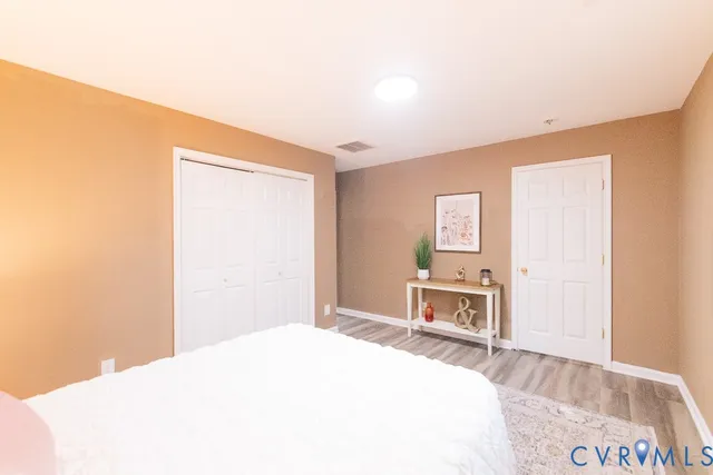 a bedroom with a bed and a dresser