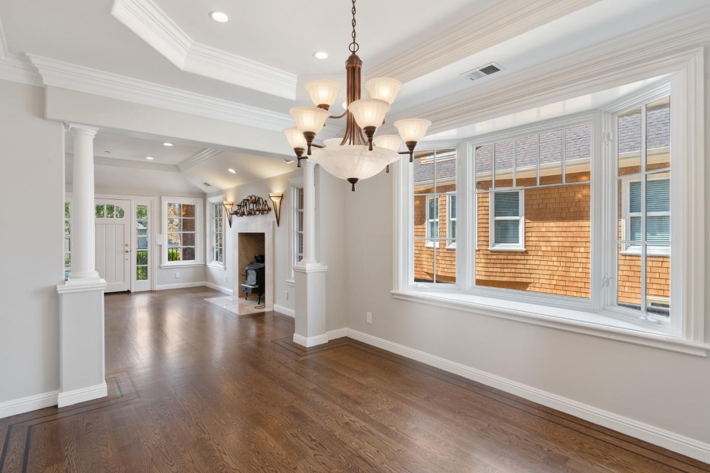 612 Prospect Row San Mateo, CA 94401 - Photo 13 of 54 a view of a big room with wooden floor chandelier and windows