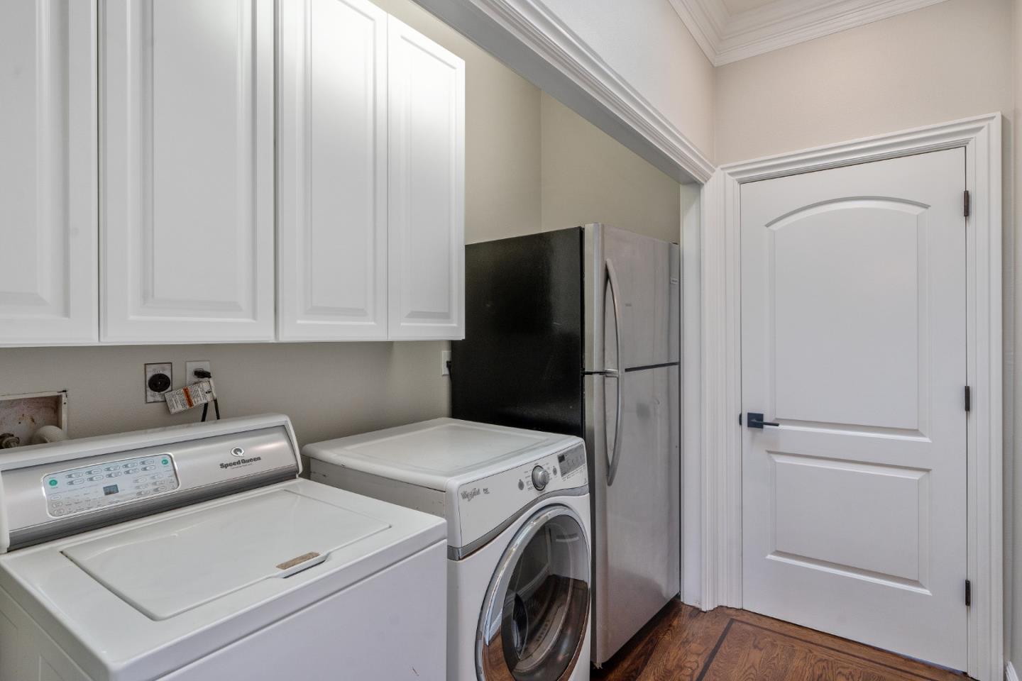 612 Prospect Row San Mateo, CA 94401 - Photo 14 of 54 a view of storage and utility room with washer and dryer