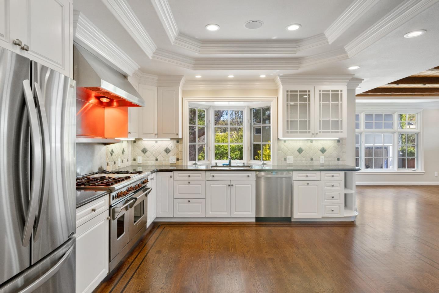612 Prospect Row San Mateo, CA 94401 - Photo 15 of 54 a large kitchen with stainless steel appliances granite countertop a stove and a sink